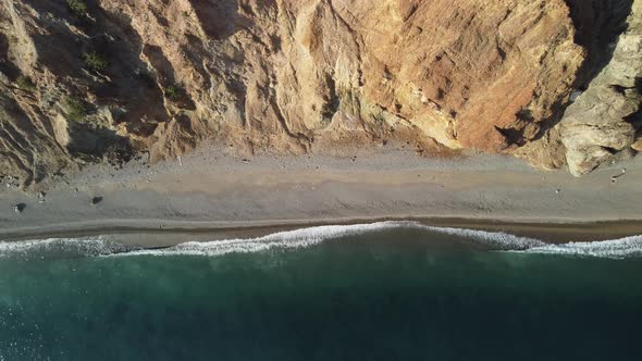 Aerial View From Above on Calm Azure Sea and Volcanic Rocky Shores