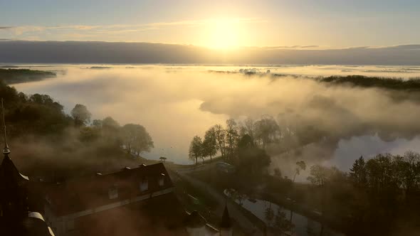 Amazing Dawn in the Foggy Nesvizh Fog Over the River