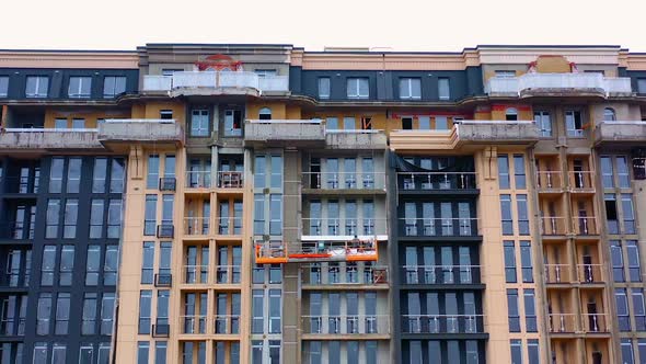 Building of a modern block of flats. Construction of a tower building in the city. 