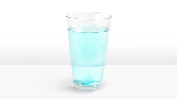 Tablet Turns Glass Of Water Blue