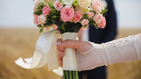 Colorful Wedding Bouquet At Bride's Hands