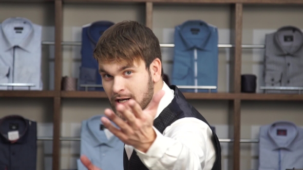 Fashion Man In Suit Posing In Wear Shop