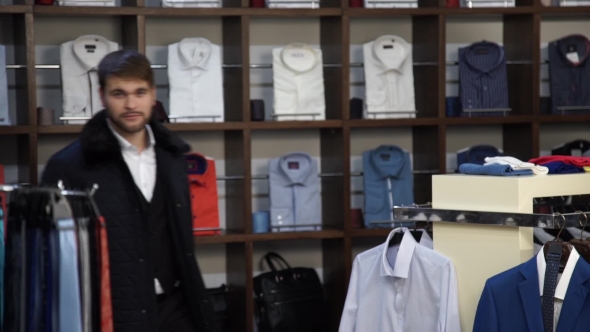 Fashion Man In Suit Smiling And Fooling In Wear Shop