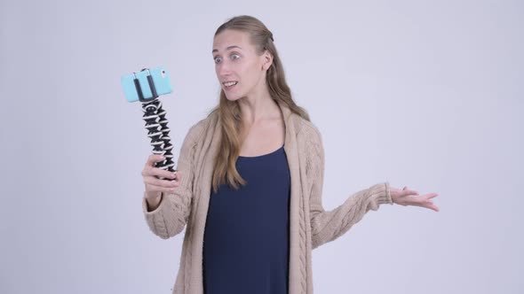 Happy Young Pregnant Woman Vlogging with Phone