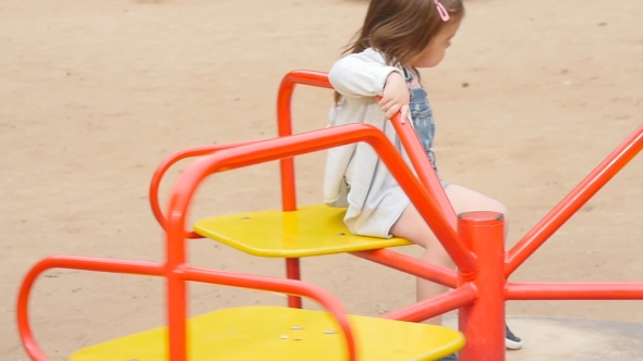 Happy Toddler Girl On The Playground 