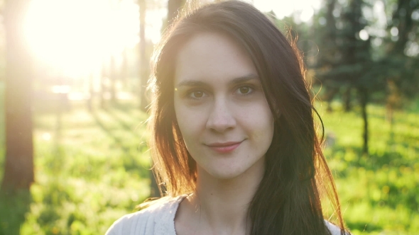 Woman Looking Into The Camera Turns And Walks Away