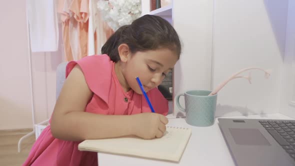 Mother and daughter doing homework together. alt