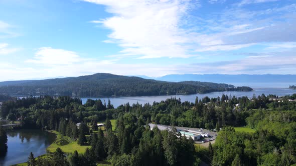 Aerial footage of pacific ocean views and peninsulas with rainforests on Vancouver Island. Slowly lo