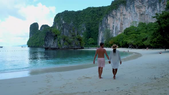Couple Men and Woman on the Beach of Koh Hong Island Krabi Thailand Asian Woman and European Men on
