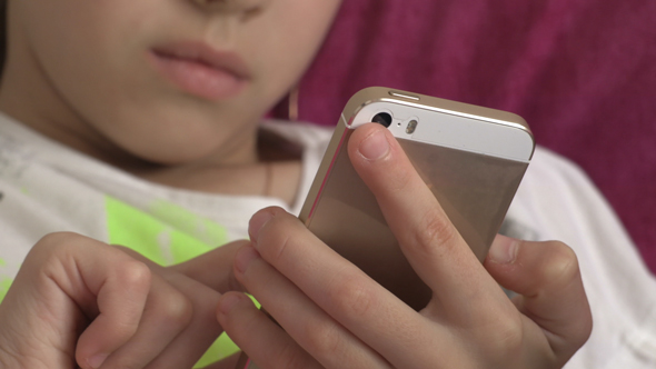 Young Girl Using Smartphone At Home 03