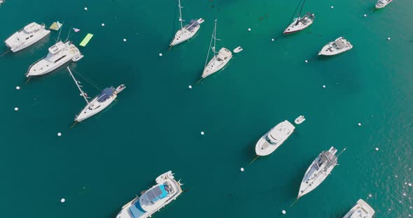 Aerial Shot of Boats on Sparkling Ocean Water, Drone Perspective of Boats in Turquoise Blue Harbor a