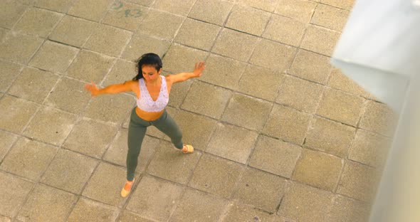 Beautiful female dancer dancing in the city 4k