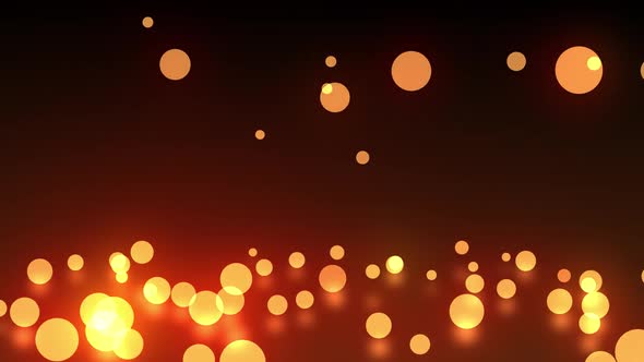 Animation of multiple glowing orange balls of spots of light falling on dark red background