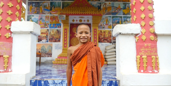 Novice Monk Walking And Smiling