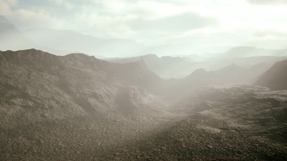 Aerial Vulcanic Desert Landscape with Rays of Light alt