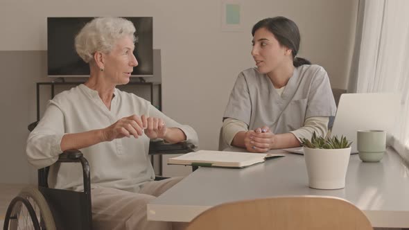 Senior Lady Talking to Female Social Worker