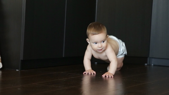 Little Cute Baby Crawling On The Floor. 