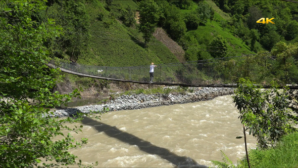 Woman Walking on the Hanging Suspension Bridge (2 Clips)