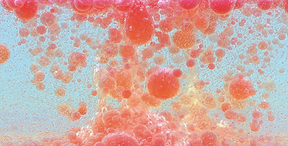 Red Oil and Water Drops in Motion alt