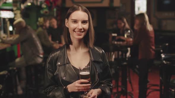 Portrait Of Attractive Young Woman At Bar