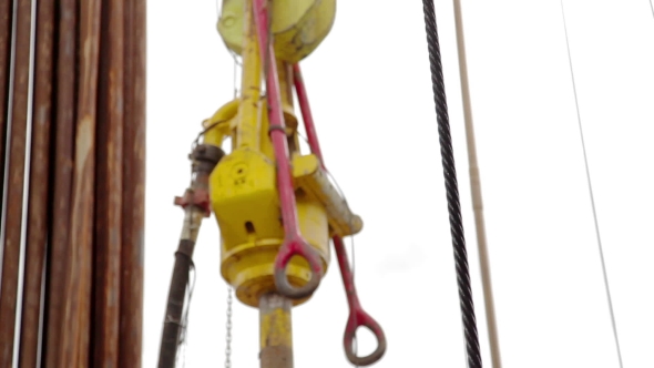 Drilling Rig Descent Tubes With a Crane