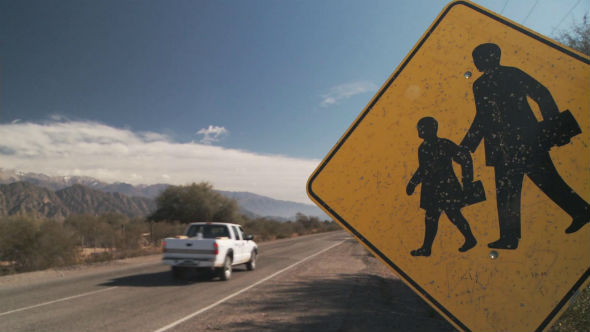 School Traffic Sign on Countryside Road near the Andes Mountains, Argentina.