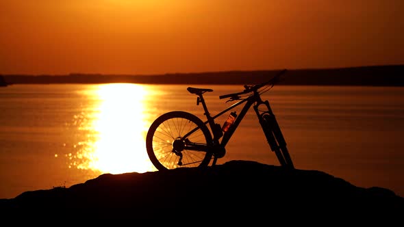 Modern bicycle on the background of the beautiful sunset.