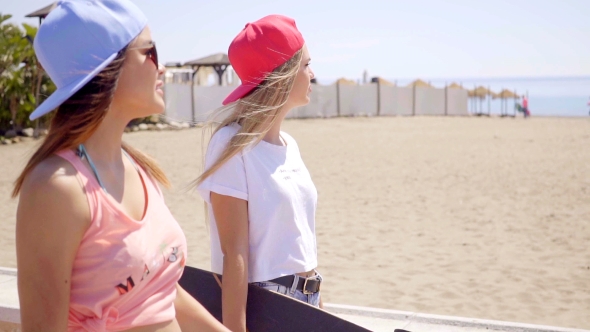 Carefree Friends Near Beach With Wind Blown Hair