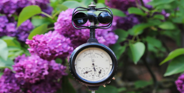The Anemometer On The Background Of Blooming Lilacs