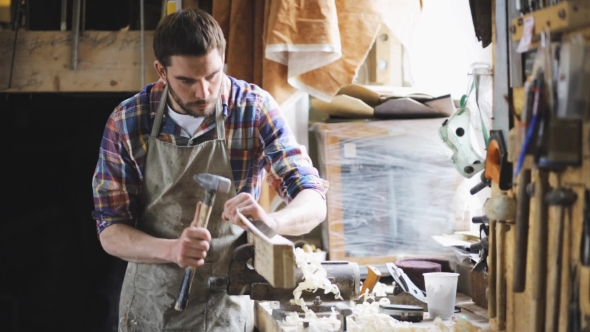 Carpenter With Chisel And Hammer At Workshop 5