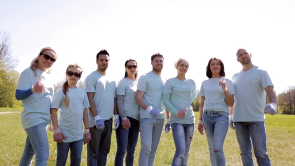 Group Of Volunteers Showing Thumbs Up In Park 32