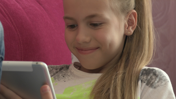 Young Girl Using Tablet At Home 11