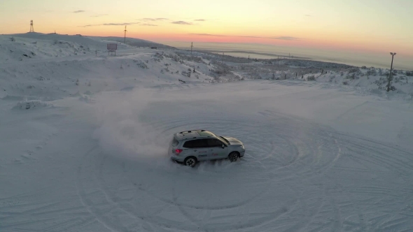Flying Over The Car Drifting On Snow