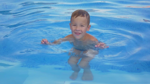 Smiling Boy In Swimming Pool