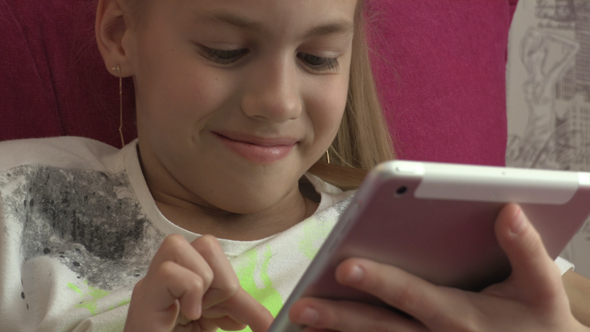 Young Girl Using Tablet At Home 16