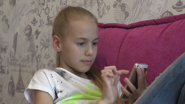 Young Girl Using Smartphone At Home 07