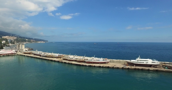 Boats And Small Yachts Docked At Harbour