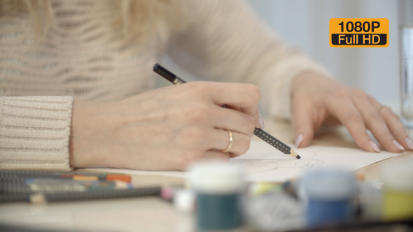 Girl Drawing a Picture With Pencil 2