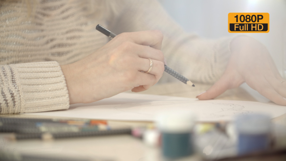 Girl Drawing a Picture With Pencil 4