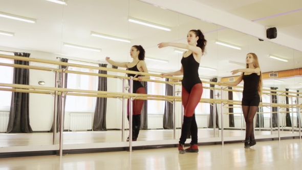 Two Beautiful Girls Doing Exercises