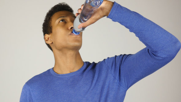 Thirsty Man Drinking Water from Bottle