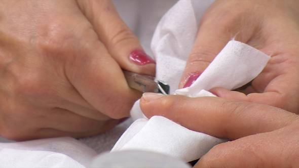 Manicurist Makes Female Manicure With Nail Clippers