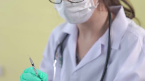 Young Man Visits Skillful Doctor at Hospital for Vaccination