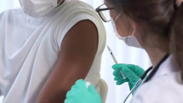 Young Man Visits Skillful Doctor at Hospital for Vaccination