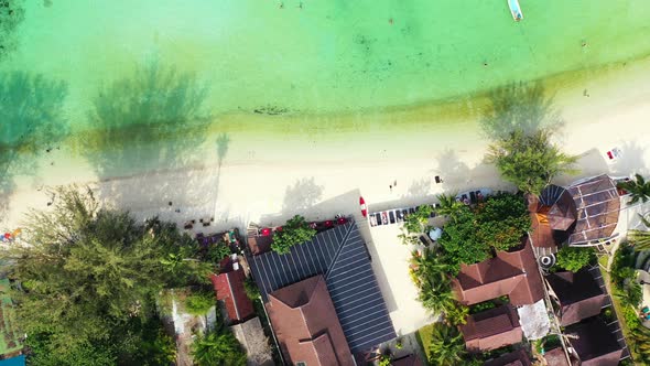 Luxury fly over abstract view of a sunshine white sandy paradise beach and blue sea background in be