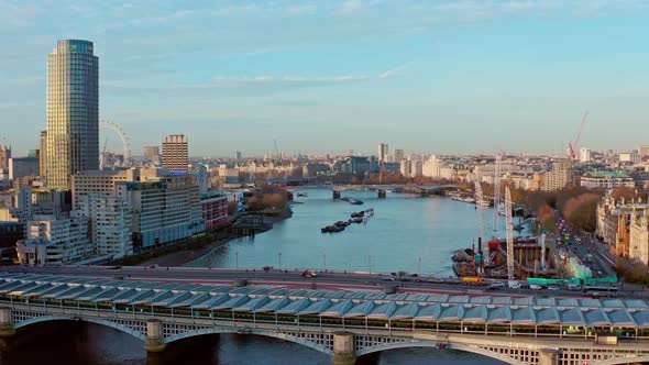 Cinematic aerial drone shot of blackfriars bridge towards London Eye and Houes of parliment London