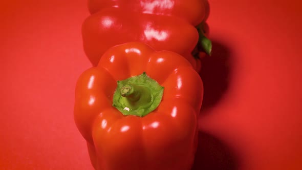Juicy Shiny Bell Pepper on a Red Background