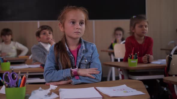 Pupils Attentively Listening To School Teacher