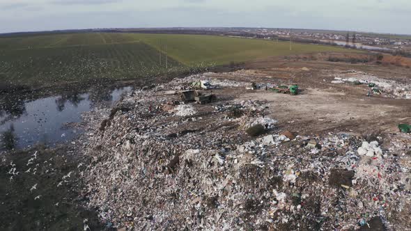Aerial View on City Rubbish Dump with Flocks of Seagulls