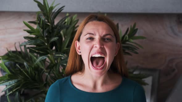 Young Angry Business Woman Is Screaming. Depressed, Stressed Beauty Woman Is in Disappointment.